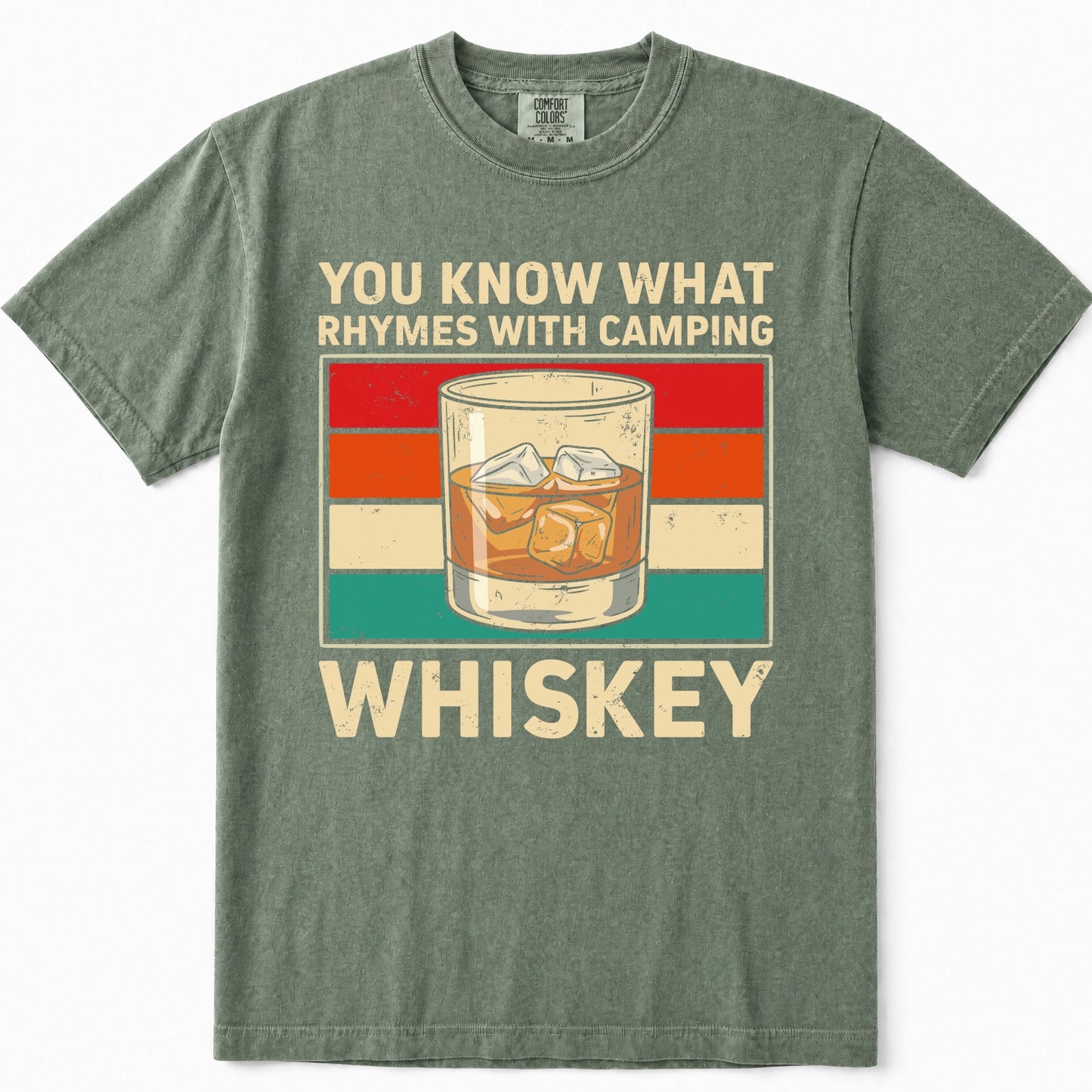 Moss green t-shirt featuring a retro graphic design with the text 'YOU KNOW WHAT RHYMES WITH CAMPING WHISKEY' and an illustration of an iced whiskey glass against a striped background.