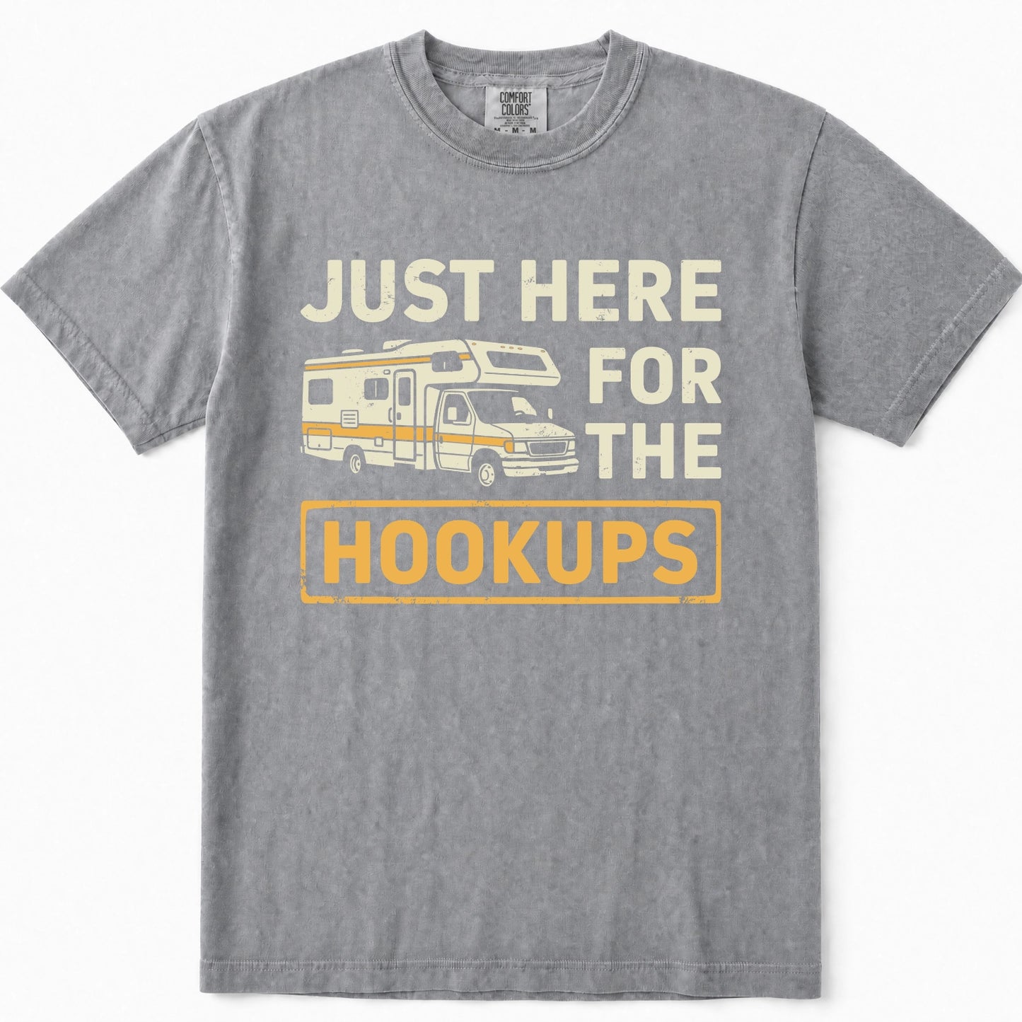 Grey short-sleeve t-shirt with a vintage-style graphic print that reads 'JUST HERE FOR THE HOOKUPS' in cream and yellow text, featuring an illustration of a camper van in the center.