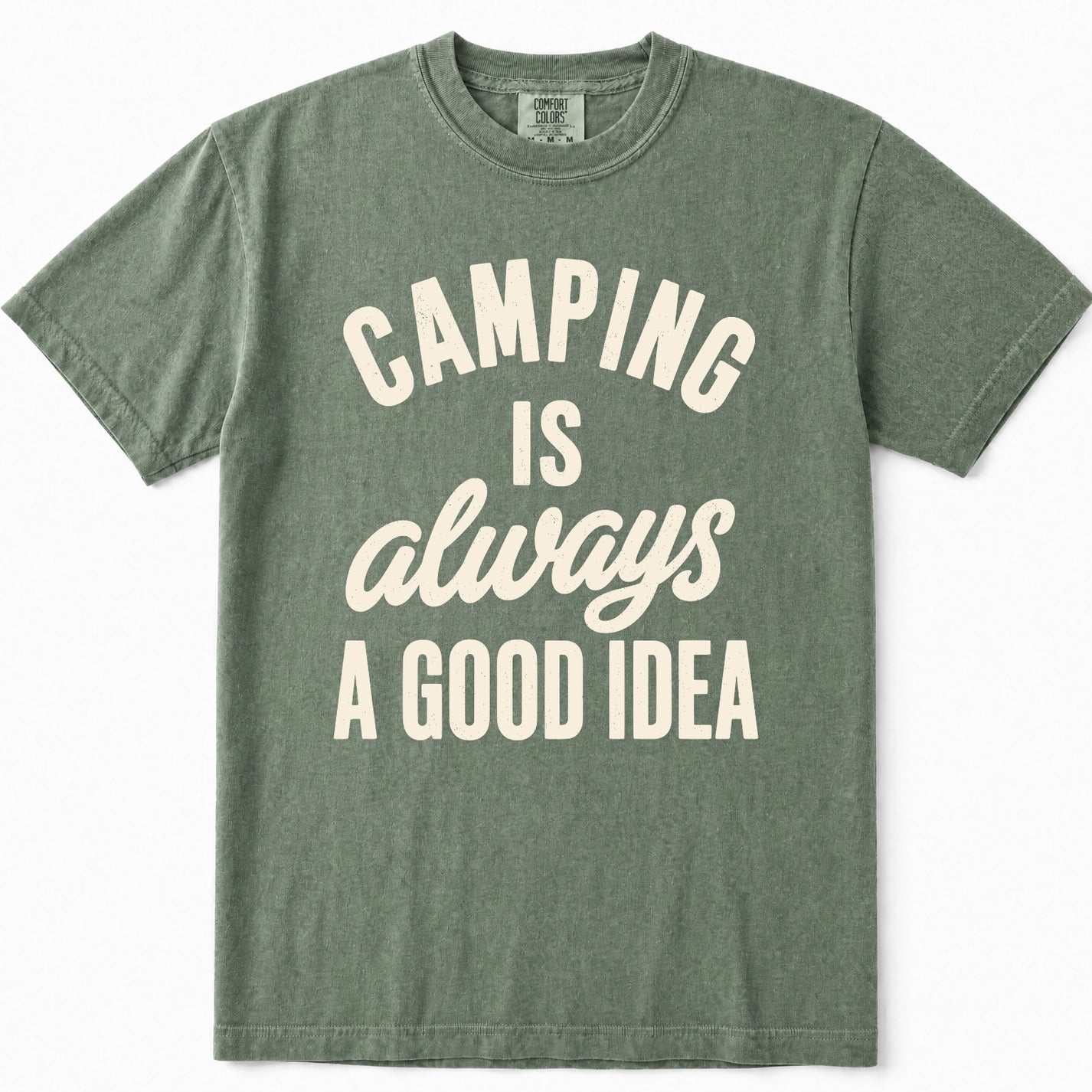 Moss green crewneck t-shirt with a cream-colored graphic text print that reads 'CAMPING IS always A GOOD IDEA'.