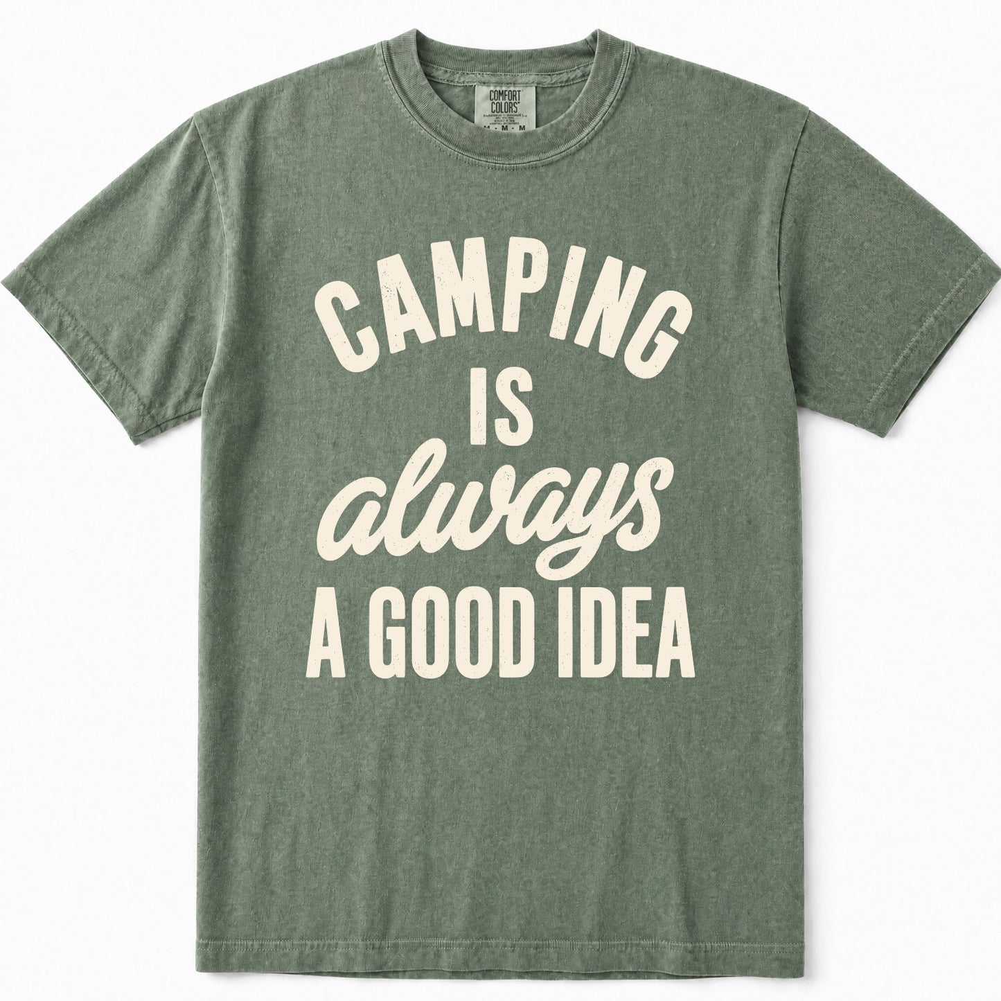 Moss green crewneck t-shirt with a cream-colored graphic text print that reads 'CAMPING IS always A GOOD IDEA'.
