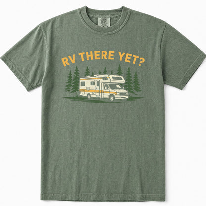 Moss green t-shirt featuring a graphic print of a white and yellow RV surrounded by pine trees, with the text 'RV THERE YET?' in yellow above it, displayed on a clean white background.