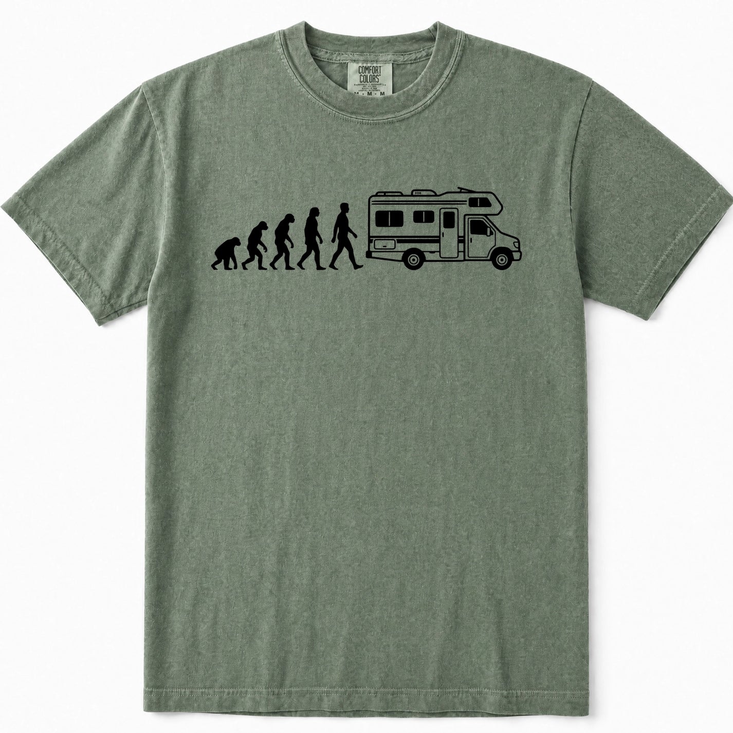 Moss green crewneck t-shirt featuring a black graphic print of the evolution of man leading up to a walking person next to a camper RV, displayed on a clean white background.