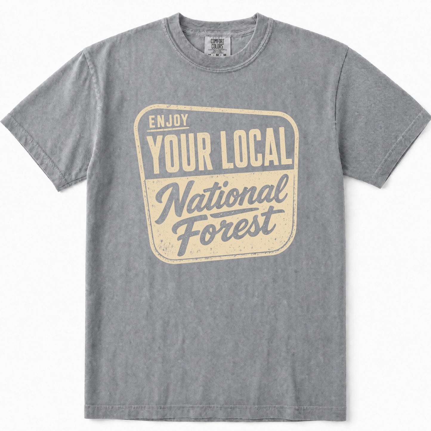 Grey short-sleeve t-shirt with a vintage-style graphic on the chest that reads 'ENJOY YOUR LOCAL National Forest' in cream and slate blue.
