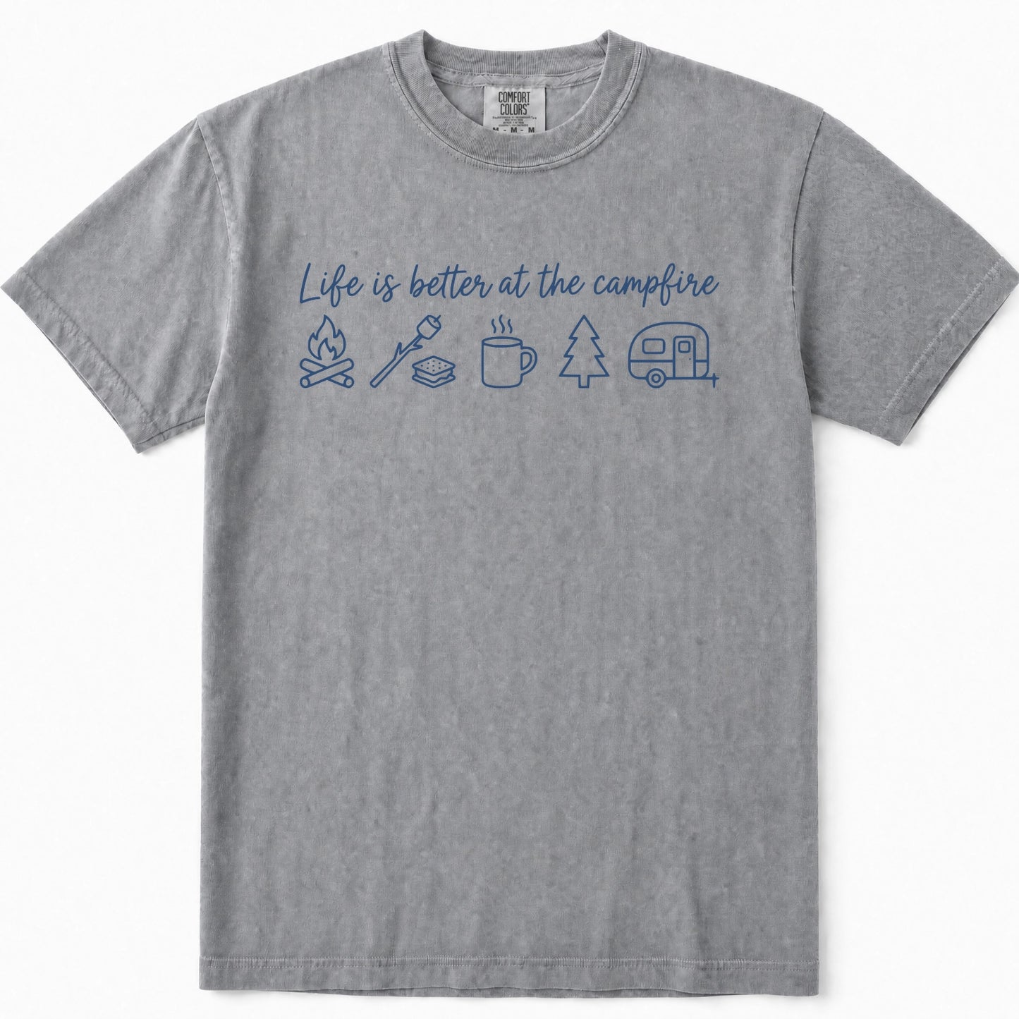 Grey short-sleeve crewneck t-shirt featuring a blue graphic print on the front with the text 'Life is better at the campfire' and simple icons for a campfire, marshmallow, mug, pine tree, and camper trailer.