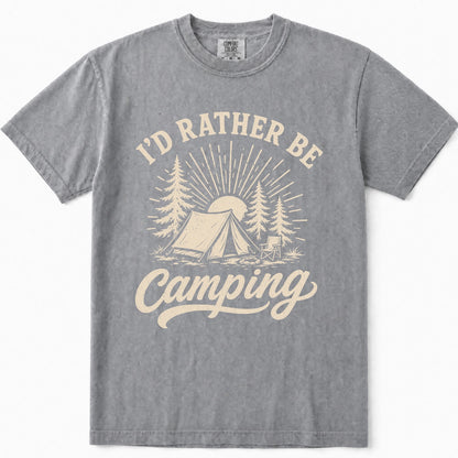 Grey short-sleeve t-shirt with a cream-colored graphic print on the front that reads 'I'D RATHER BE Camping' with an illustration of a tent, trees, and a sun.
