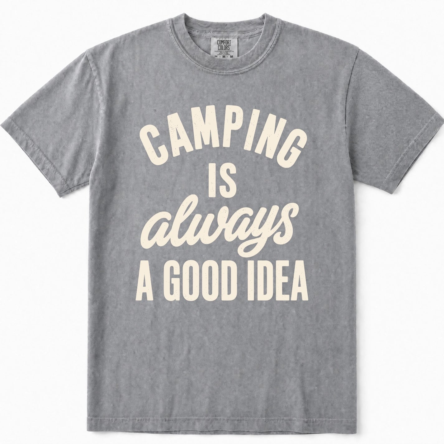 Grey short-sleeve t-shirt with a cream-colored graphic text print that reads 'CAMPING IS always A GOOD IDEA' on the front, displayed flat against a clean white background.
