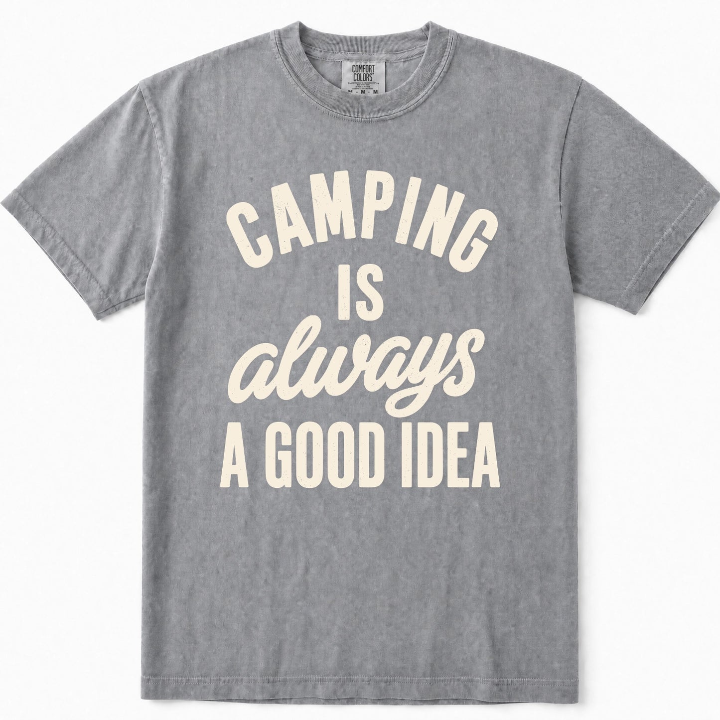 Grey short-sleeve t-shirt with a cream-colored graphic text print that reads 'CAMPING IS always A GOOD IDEA' on the front, displayed flat against a clean white background.