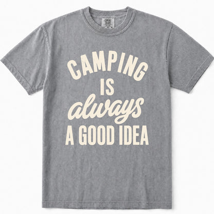 Grey short-sleeve t-shirt with a cream-colored graphic text print that reads 'CAMPING IS always A GOOD IDEA' on the front, displayed flat against a clean white background.