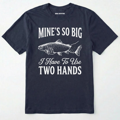 Navy t-shirt with white text and fish graphic on a light grey background
