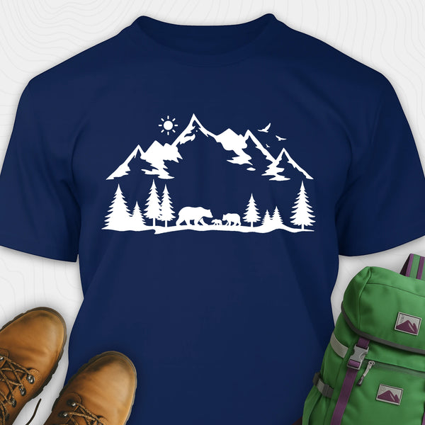 Navy blue wildlife t-shirt with white mountain and bear design, paired with brown boots and a green backpack.