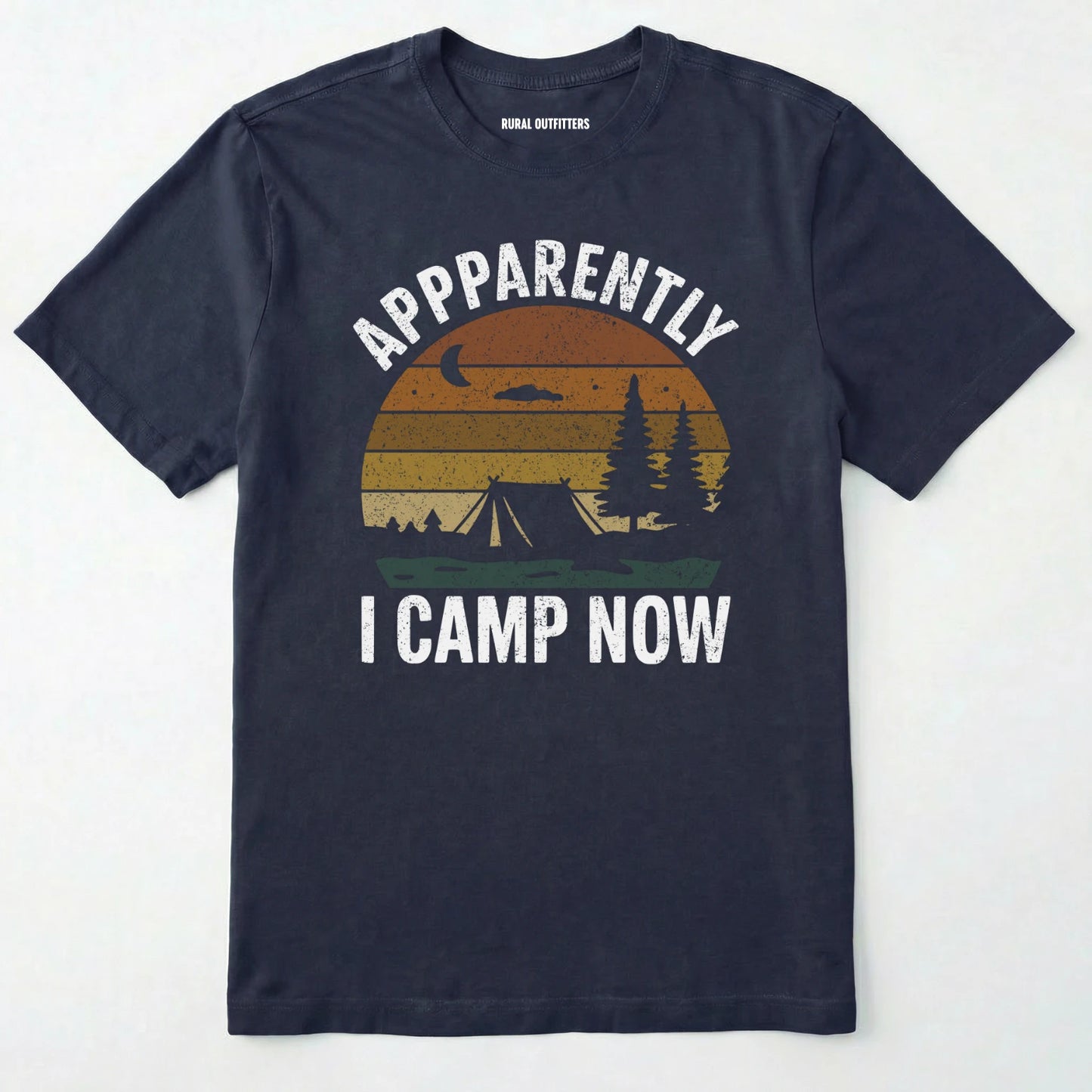 Navy t-shirt with ⊜apparently i camp now⊝ in white text and a vintage sunset camping scene on a white background.