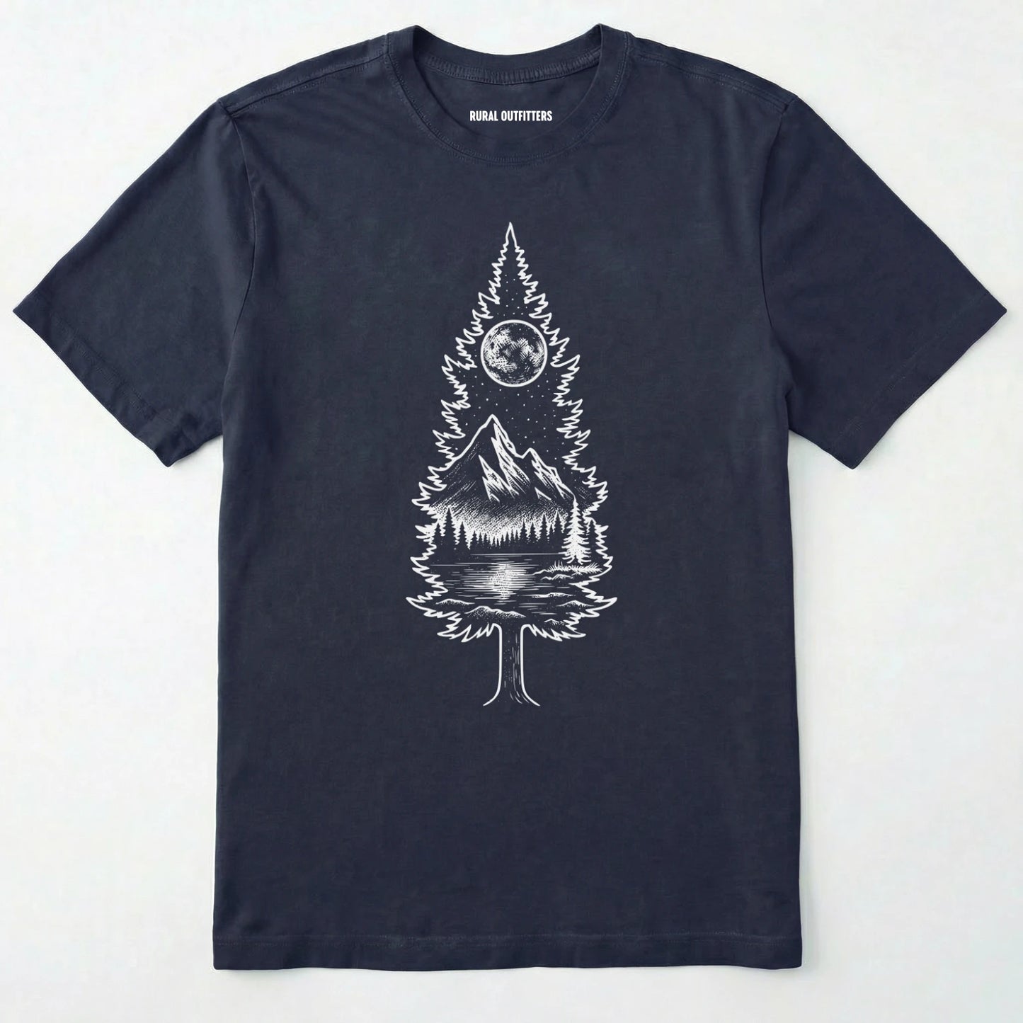 Navy tree t-shirt featuring a detailed white graphic of a pine tree silhouette. the tree outline contains a landscape scene: a mountain peak rising over a forested shoreline, with its reflection visible in a lake below. above the mountain is a starry night sky and a full or partial circle representing the moon or sun.