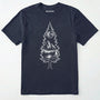 Navy tree t-shirt featuring a detailed white graphic of a pine tree silhouette. the tree outline contains a landscape scene: a mountain peak rising over a forested shoreline, with its reflection visible in a lake below. above the mountain is a starry night sky and a full or partial circle representing the moon or sun.