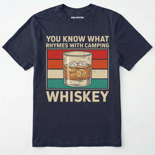 Navy blue short-sleeve t-shirt with a vintage-style graphic on the front. The graphic features the text 'YOU KNOW WHAT RHYMES WITH CAMPING' above a retro striped background and an illustration of a whiskey glass, followed by the word 'WHISKEY' below.