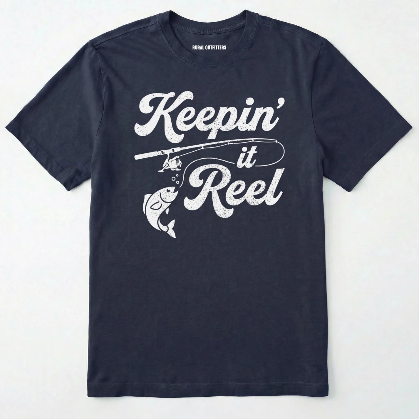 Navy t-shirt with 'keepin' it reel' text and fishing graphic on a white background