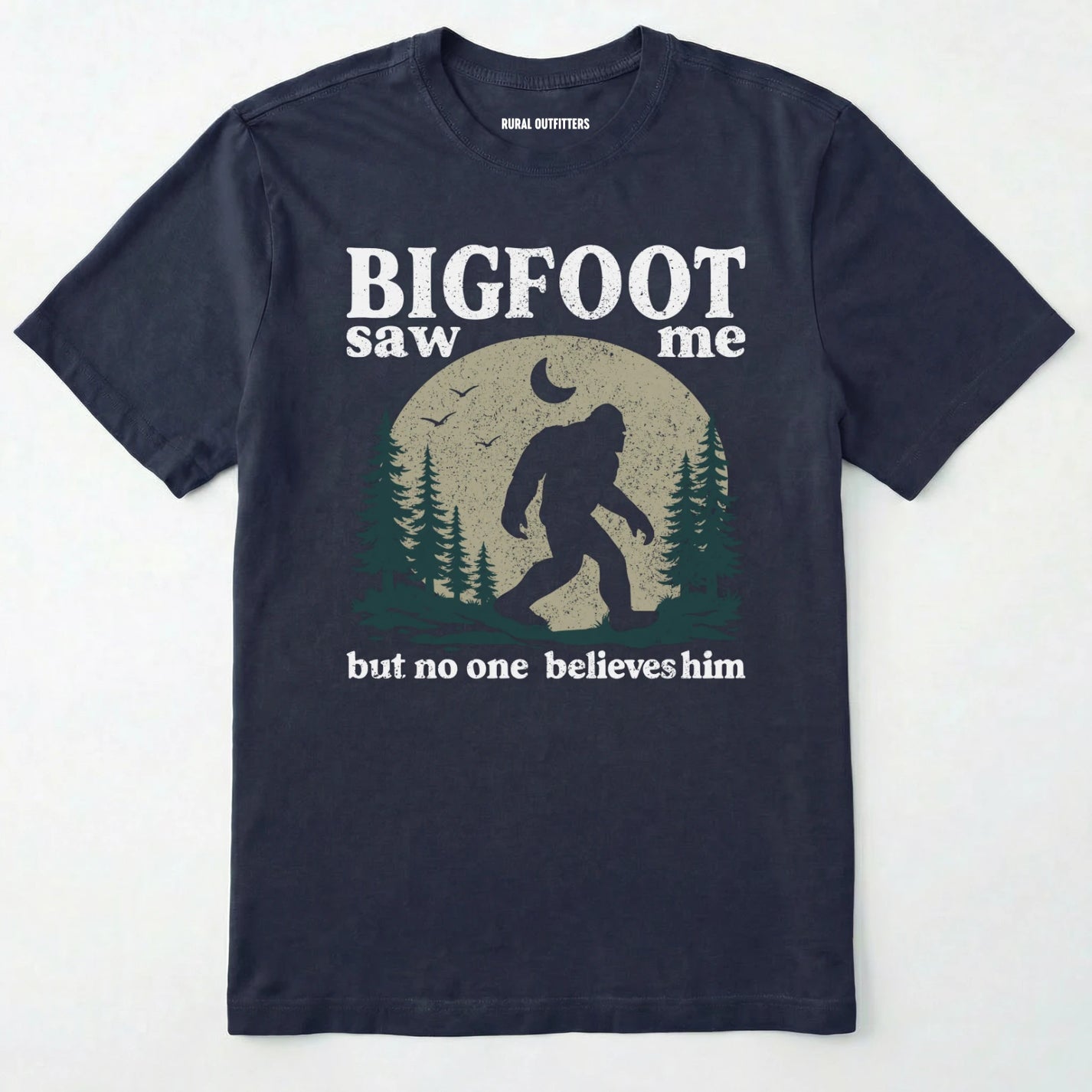 Navy bigfoot saw me shirt with a vintage outdoor sasquatch in the forest graphic on a white background.