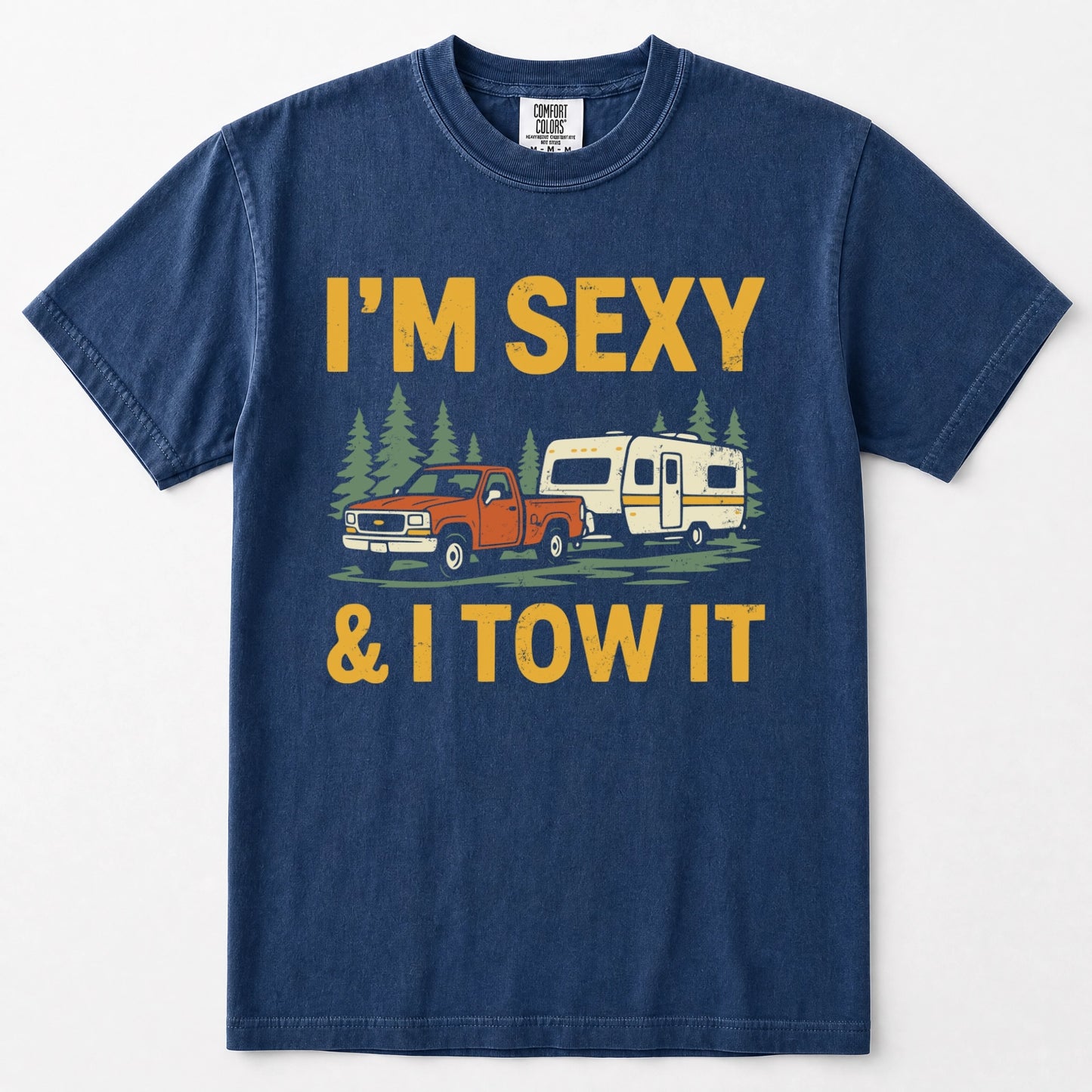 Navy blue crewneck t-shirt featuring a graphic print of an orange pickup truck towing a cream camper trailer, with the text 'I'M SEXY & I TOW IT' in yellow above and below the illustration.
