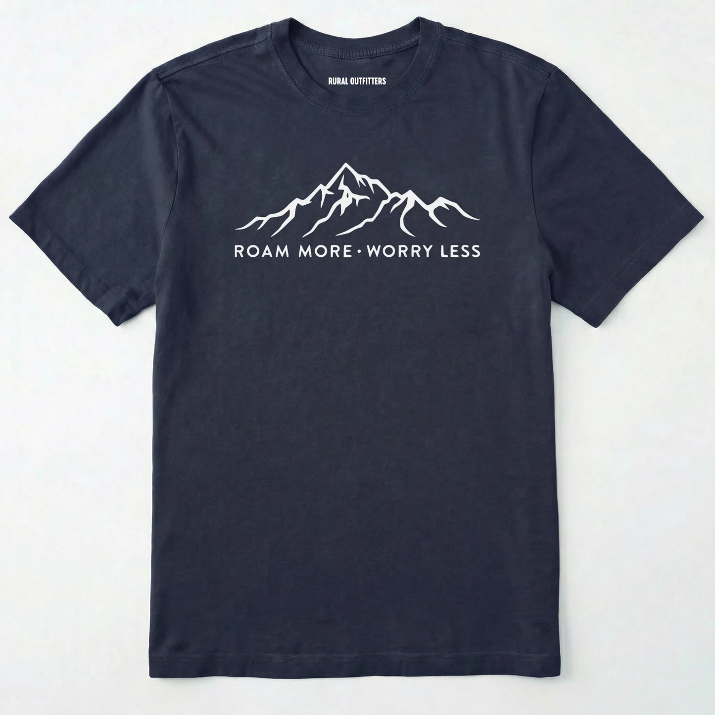 Navy rocky mountain shirt with a white mountain graphic and text 'roam more worry less' on a white background