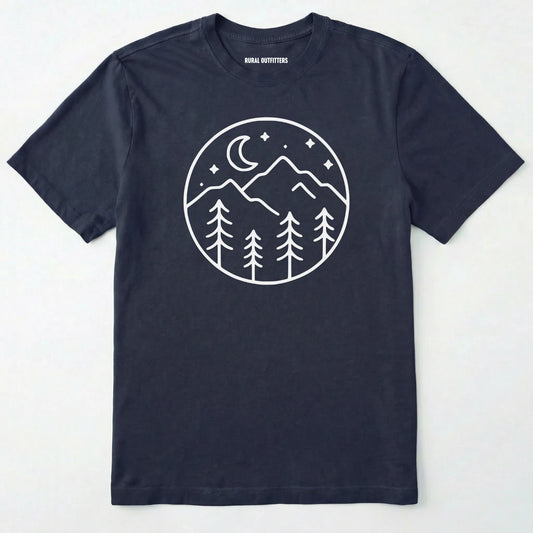 Navy moon and stars shirt with minimalist mountain and forest design on a white background.