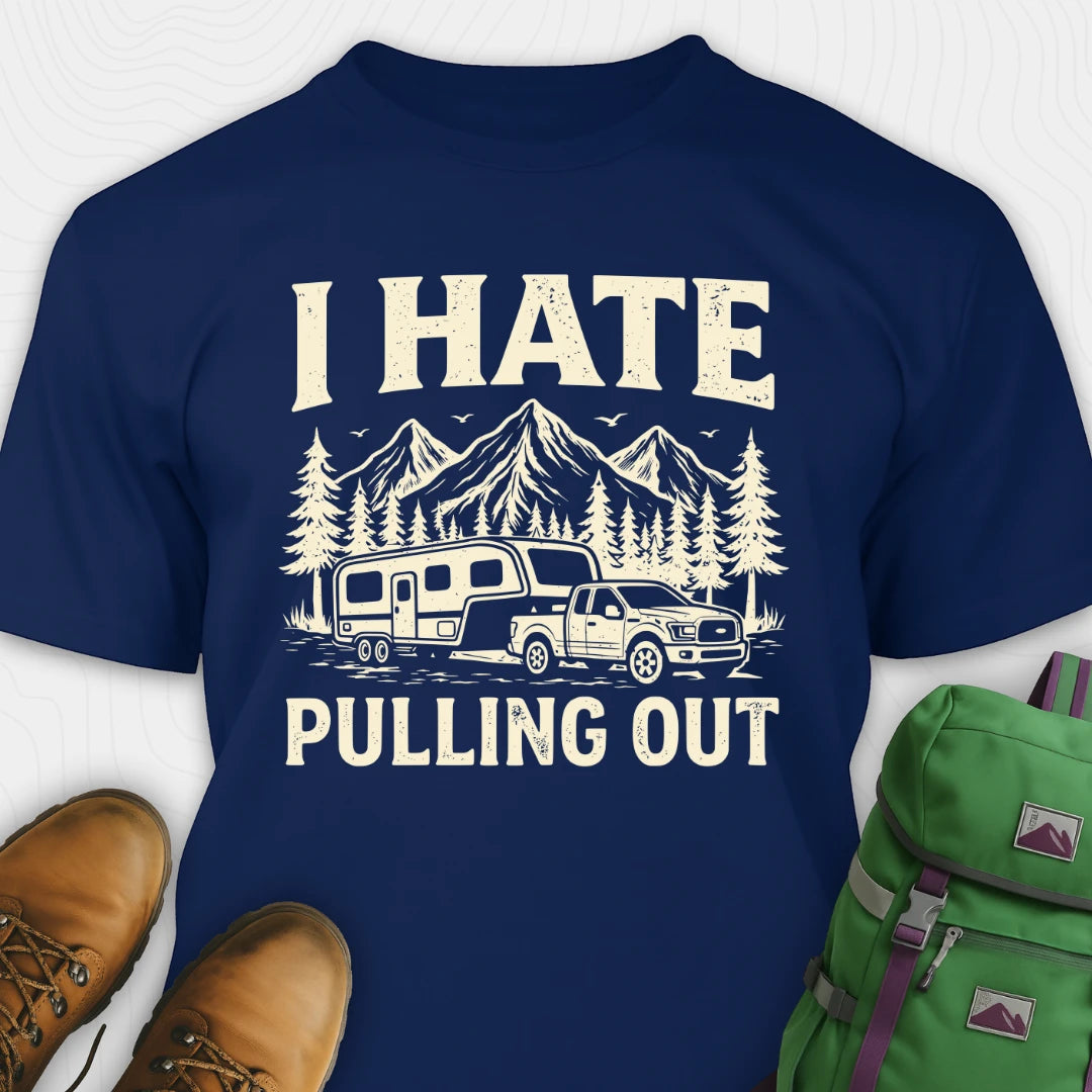 Navy blue t-shirt with a graphic and text 'I HATE PULLING OUT' on a white background, with shoes and a backpack for scale.