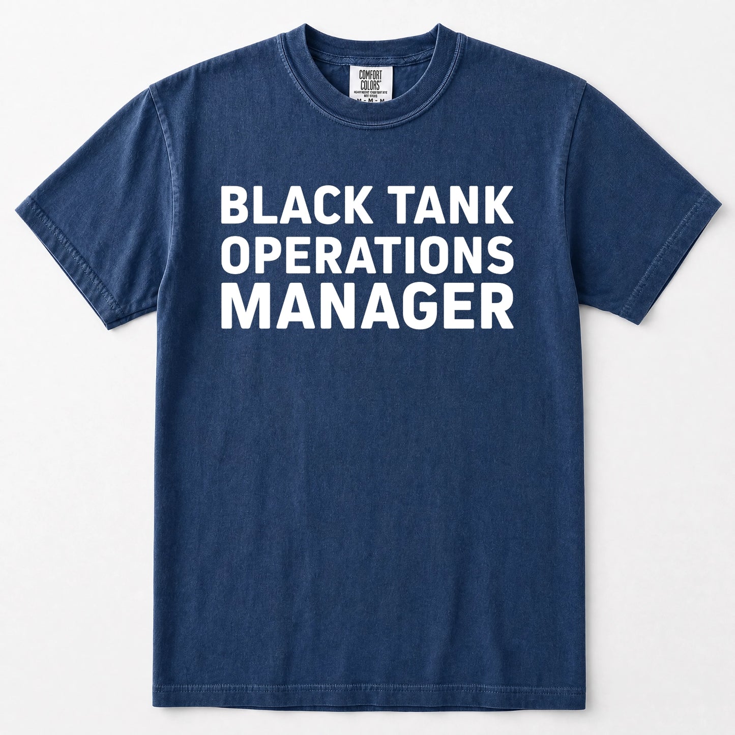 Navy blue short-sleeve t-shirt with the words 'BLACK TANK OPERATIONS MANAGER' printed in bold white capital letters across the chest, displayed flat against a light gray background.