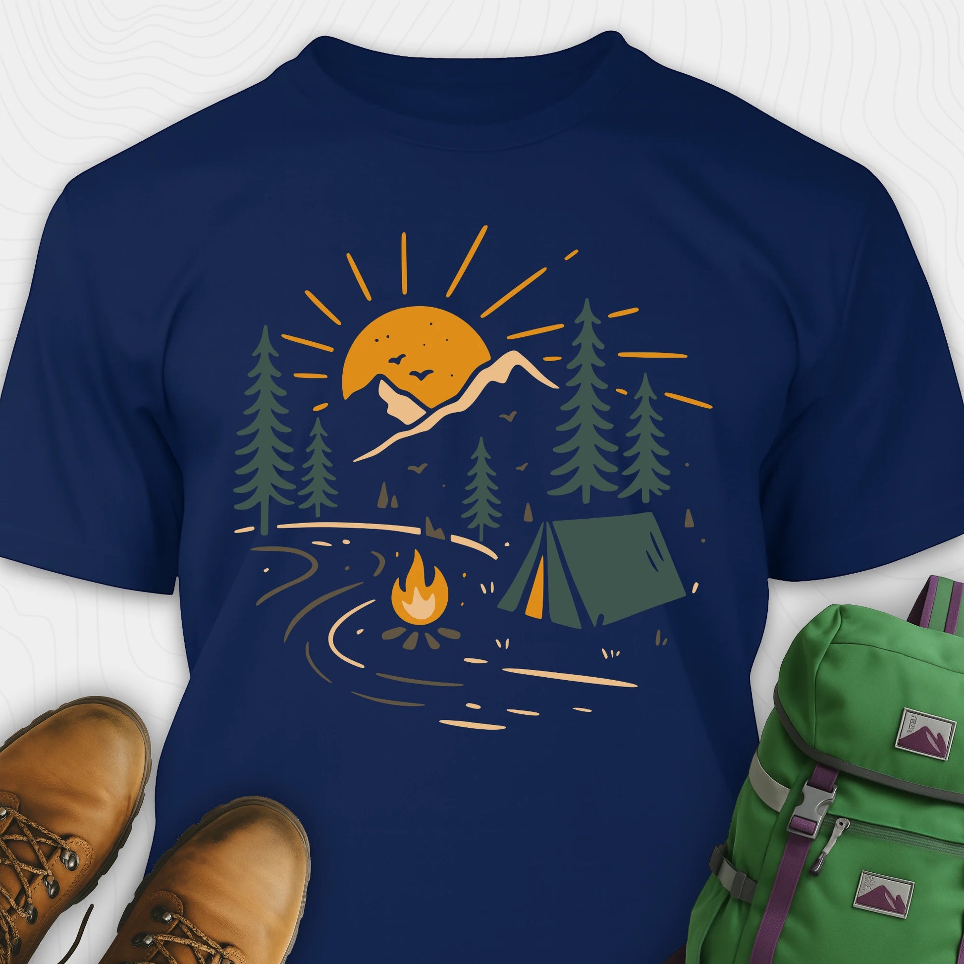 Navy wilderness explorer shirt with sunset campfire scene with tent, trees, and mountains design