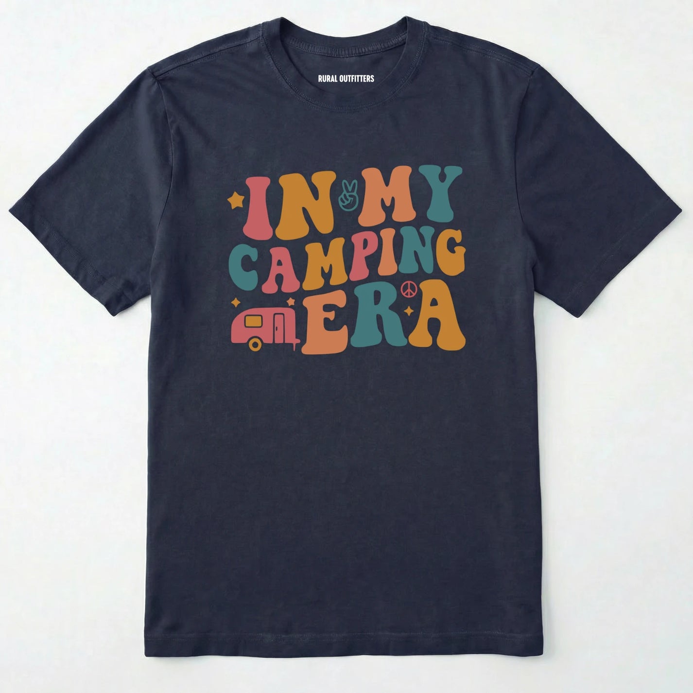 Navy cute camping shirt with colorful retro ⊜in my camping era⊝ graphic on a white background.