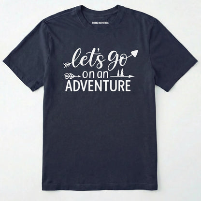 Navy lets go on an adventure shirt with an arrow and trees graphic on a light grey background.