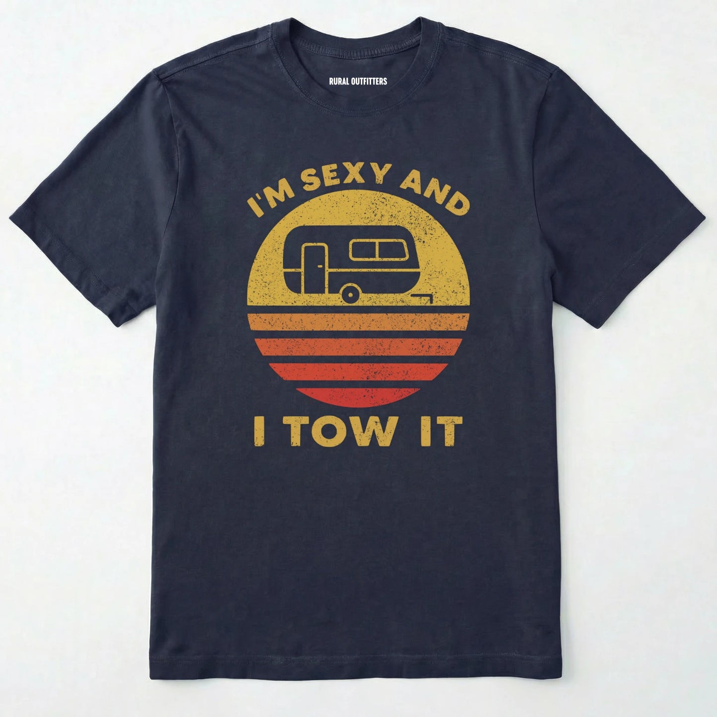 Navy trailer shirt with retro camper and sunset graphic, and "i'm sexy and i tow it" text on a white background.