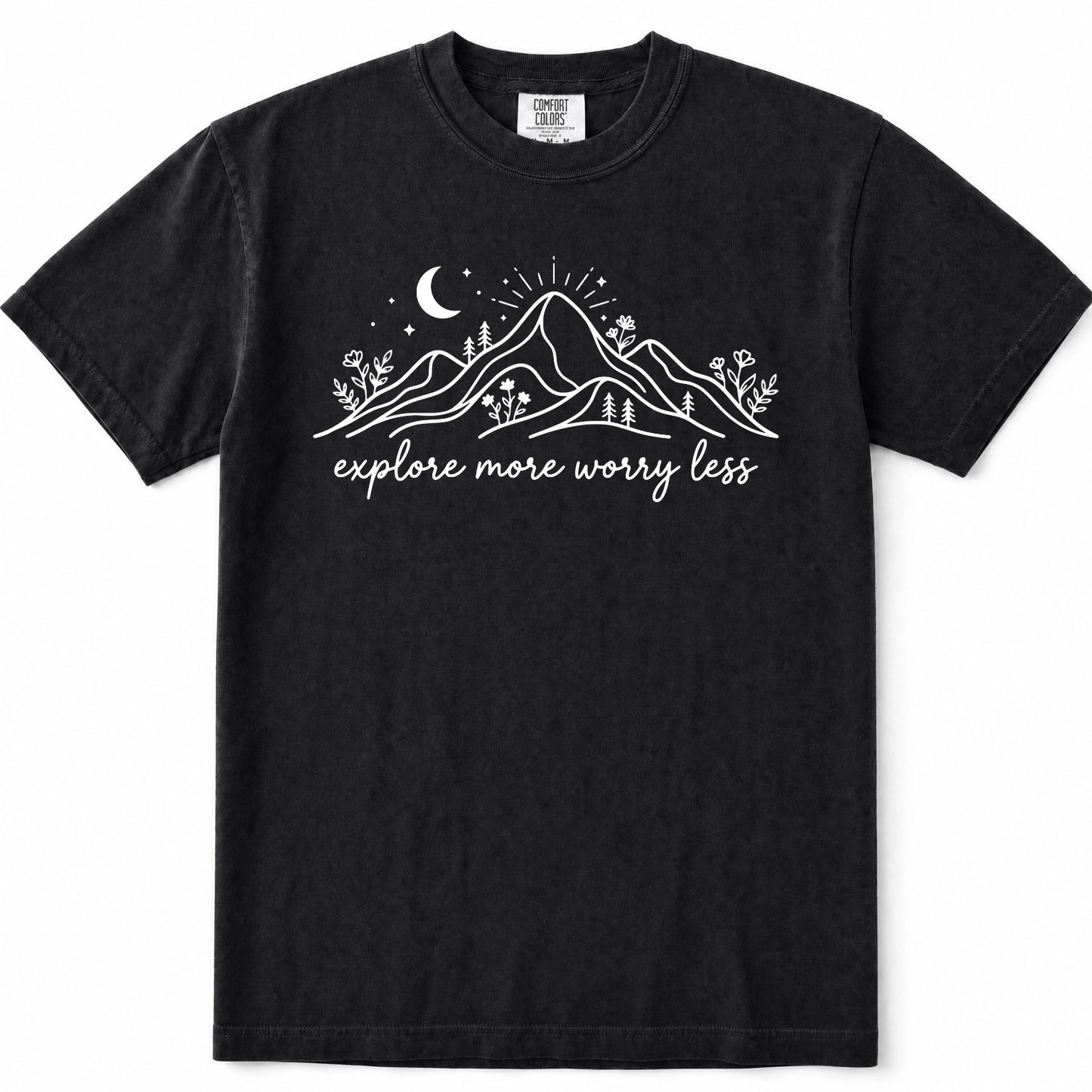 Black short-sleeve crewneck t-shirt with a white graphic print of mountains, a crescent moon, stars, and the text 'explore more worry less' on the front.