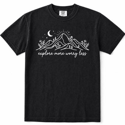 Black short-sleeve crewneck t-shirt with a white graphic print of mountains, a crescent moon, stars, and the text 'explore more worry less' on the front.