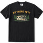 Black short-sleeve crewneck t-shirt featuring a graphic print of a cream and yellow camper van surrounded by green pine trees, with the text 'RV THERE YET?' in yellow above it, displayed on a clean white background.