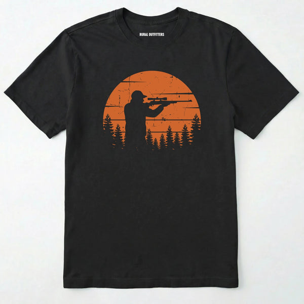 Black t-shirt with a graphic of a hunter and sunset design on a white background