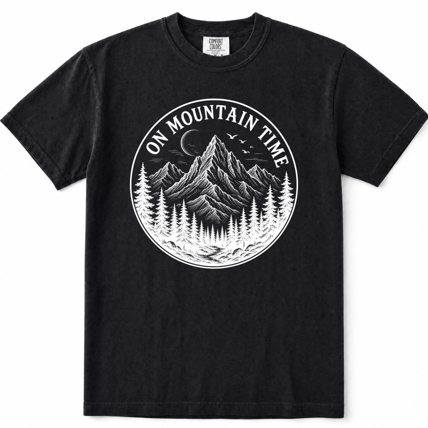 Black short-sleeve crewneck t-shirt featuring a circular white graphic print on the chest with a mountain, pine trees, and the text 'ON MOUNTAIN TIME'.