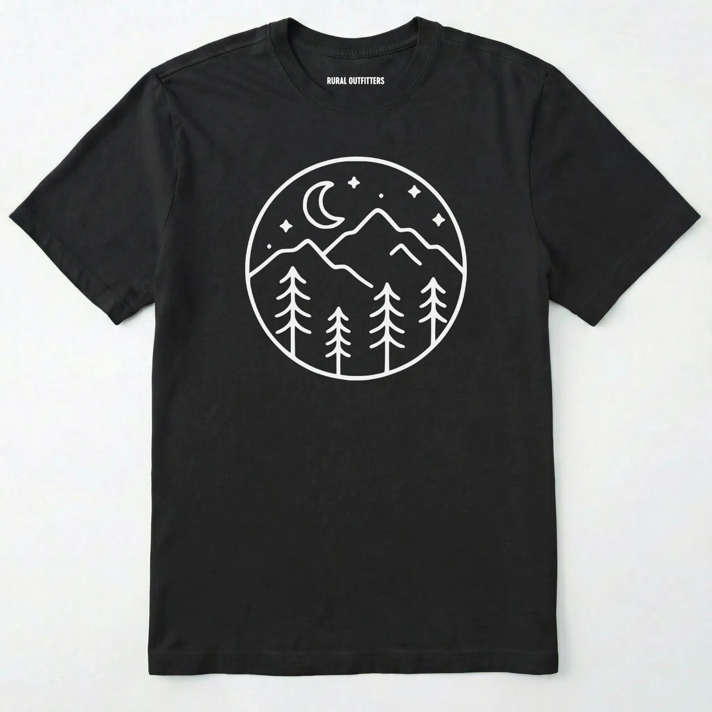 Black moon and stars shirt with minimalist mountain and forest design on a white background.