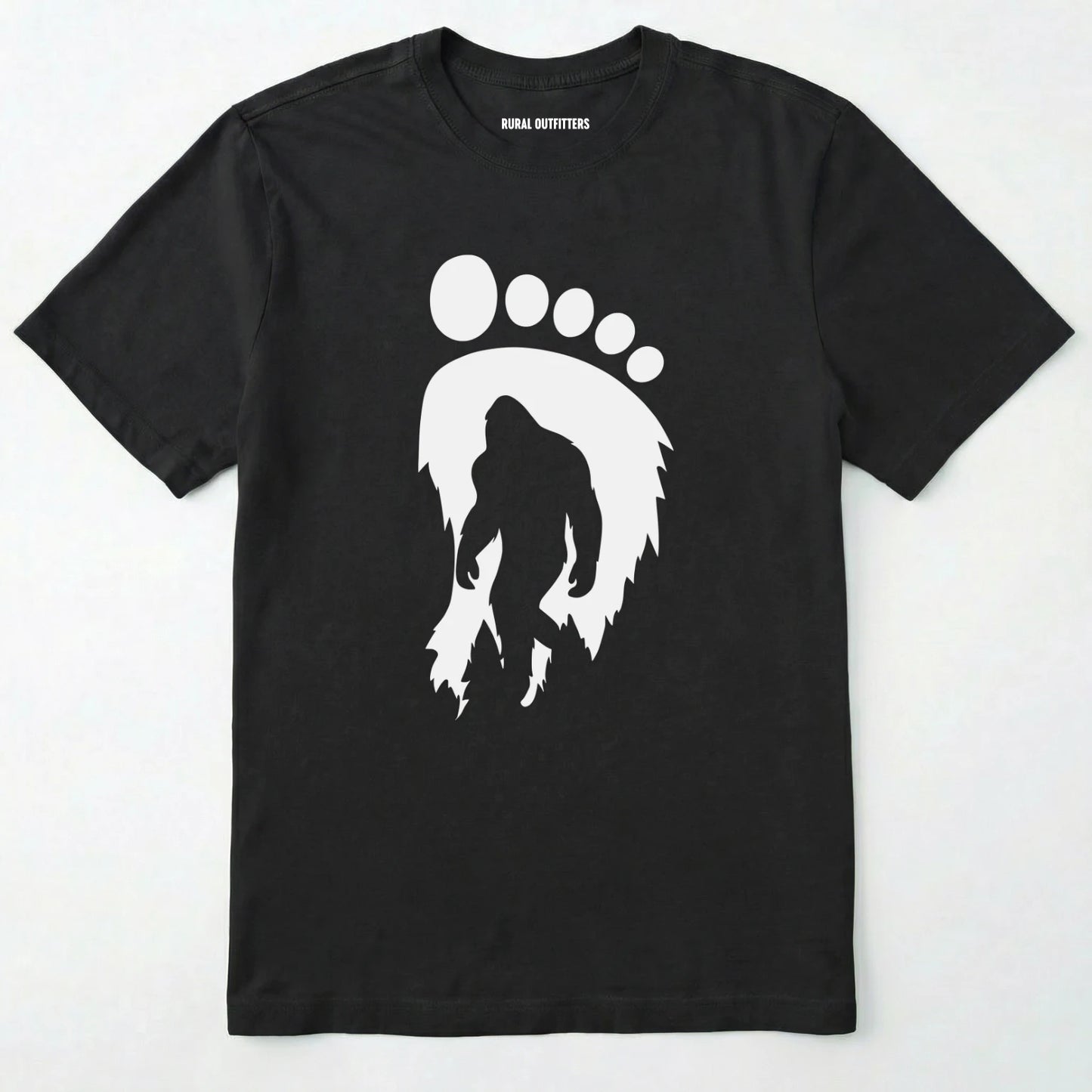 Black bigfoot t-shirt with cryptid-themed footprint graphic and sasquatch silhouette on a white background.