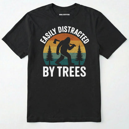 Black funny sasquatch shirt featuring bigfoot silhouette and trees on a white background.