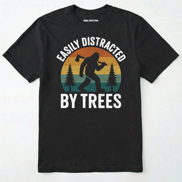 Black funny sasquatch shirt featuring bigfoot silhouette and trees on a white background.
