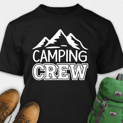 Black camping crew t-shirt with 'Camping Crew' text and mountain graphic, paired with hiking boots and a green backpack.