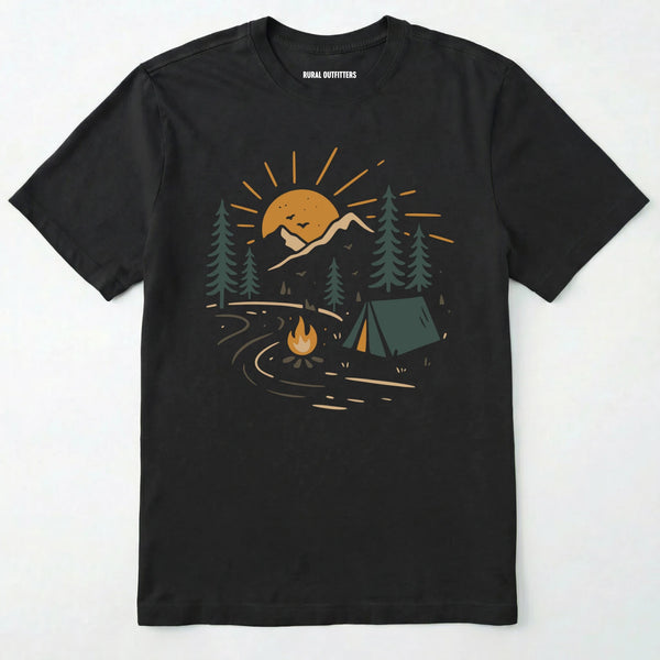 Black wilderness explorer shirt with sunset campfire scene with tent, trees, and mountains design on a white background.