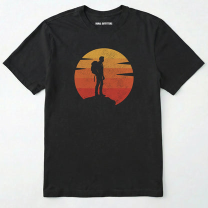 Black retro sunset t-shirt with hiker silhouette on a white background.