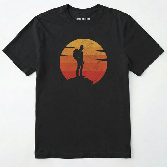 Black retro sunset t-shirt with hiker silhouette on a white background.