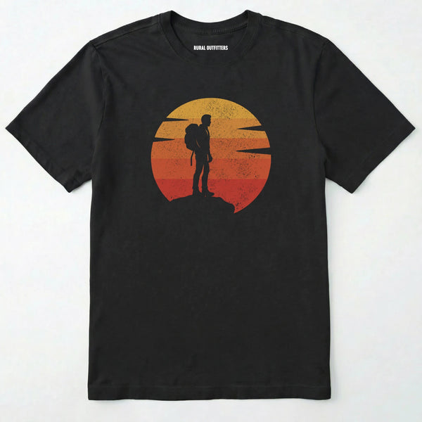 Black retro sunset t-shirt with hiker silhouette on a white background.