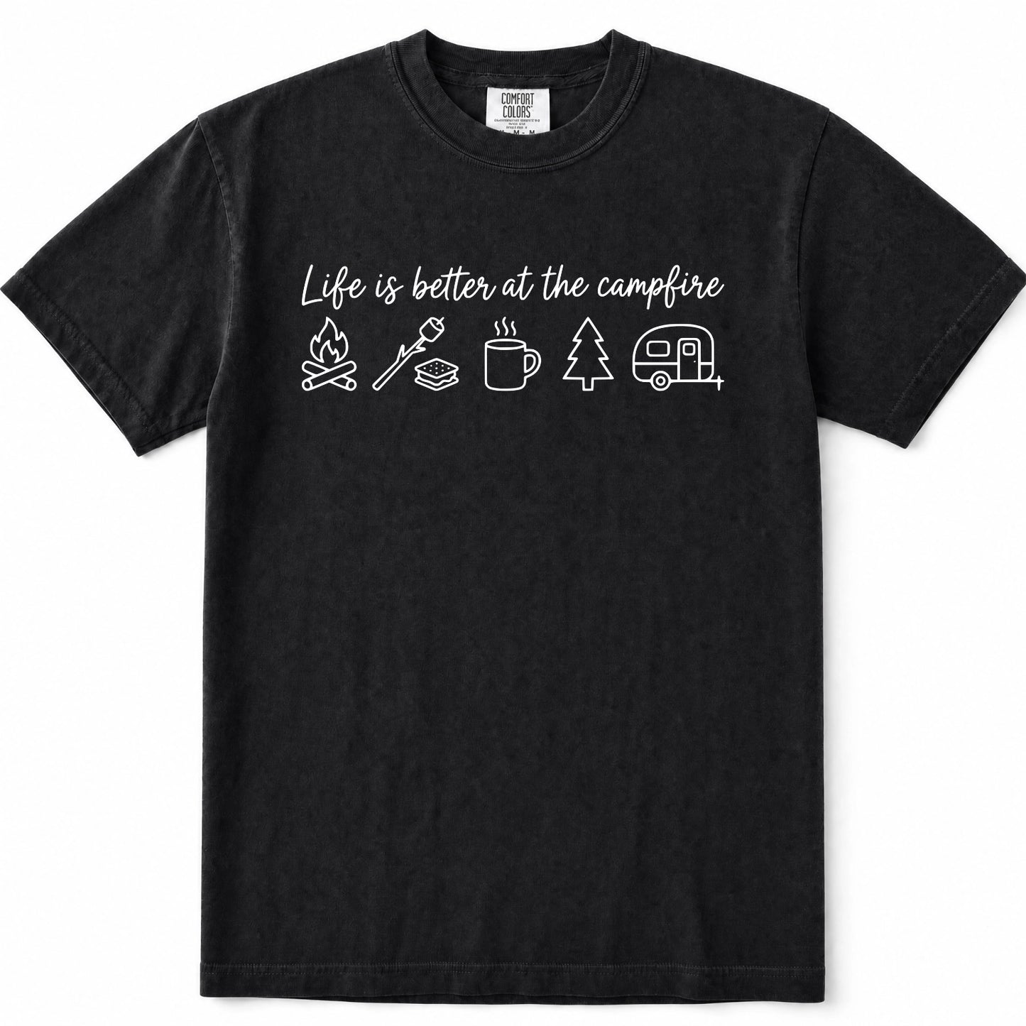 Black short-sleeve crewneck t-shirt with a white graphic print on the chest that reads 'Life is better at the campfire' above simple icons of a campfire, marshmallow, mug, pine tree, and camper trailer.