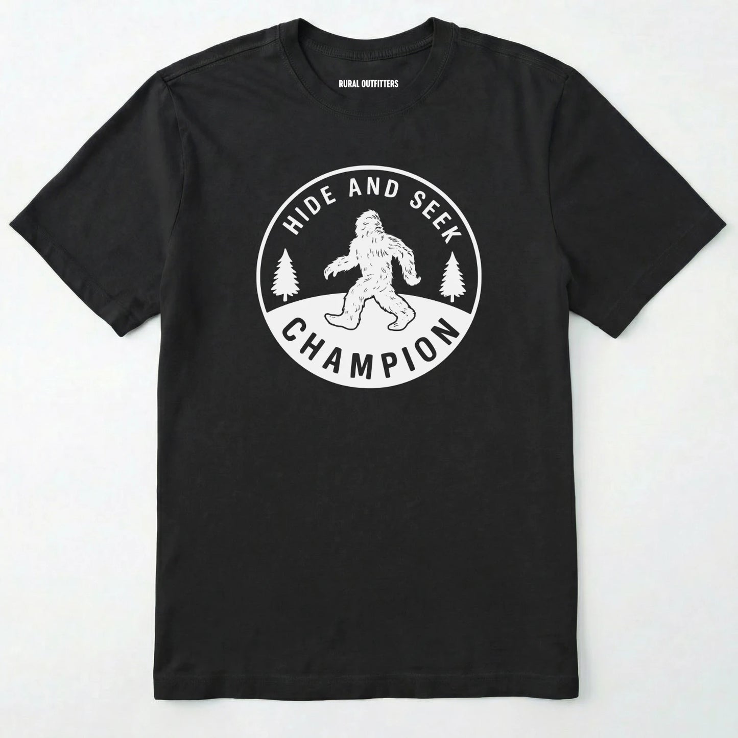 Black bigfoot hide and seek champion shirt with forest emblem on a white background.