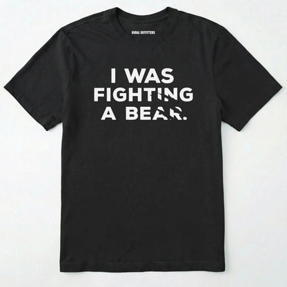 Black i was fighting a bear shirt with a bear scratch mark graphic on a white background.