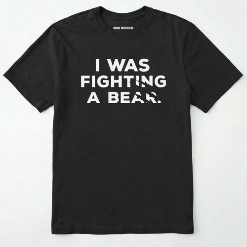 Black I was fighting a bear shirt with a bear scratch mark graphic on a white background.