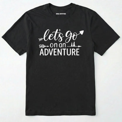 Black lets go on an adventure shirt with an arrow and trees graphic on a light grey background.