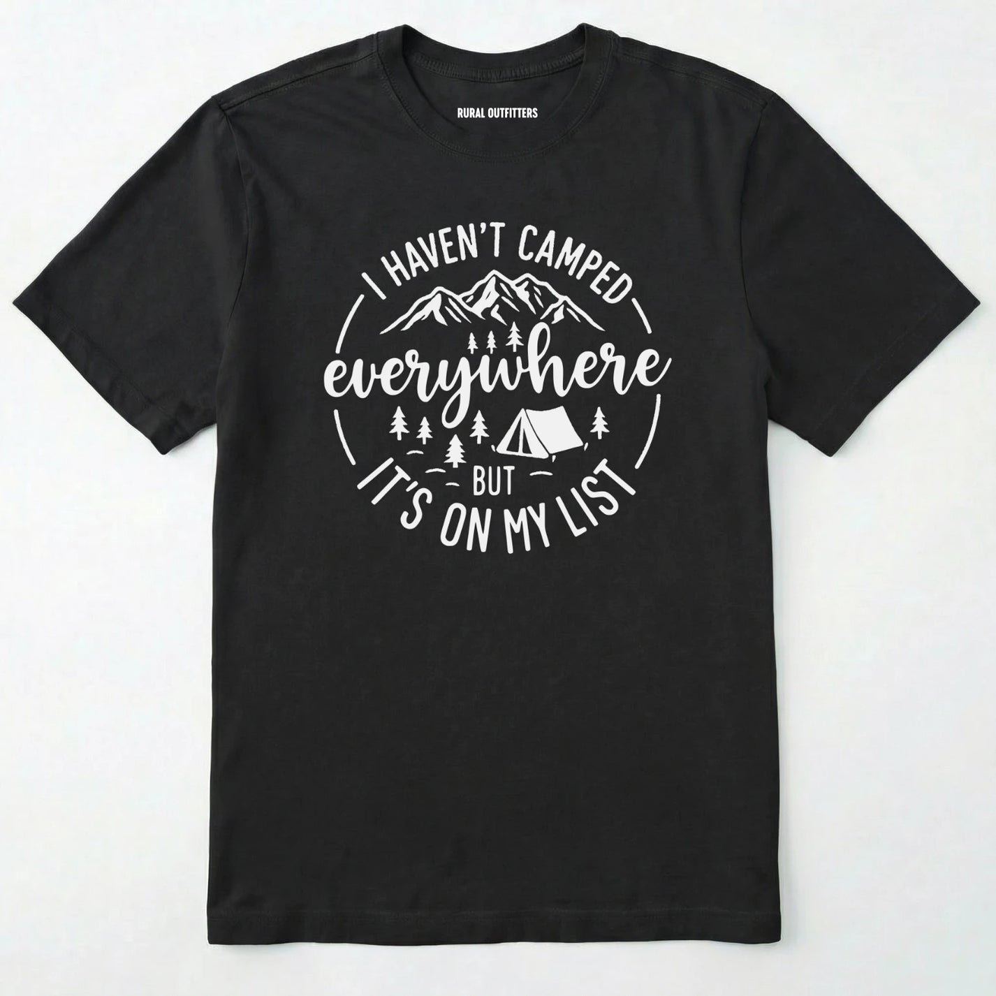 Black funny camping shirt saying with mountains, trees, tent graphic and "I Haven't Camped Everywhere But It's On My List" text on a white background.