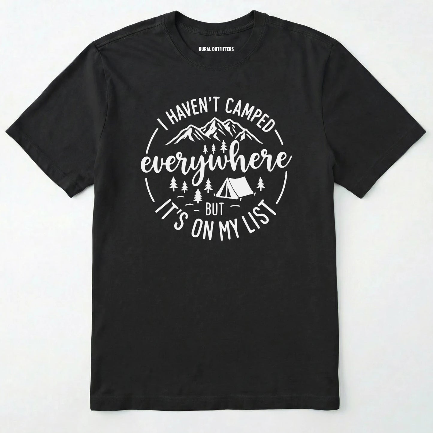 Black funny camping shirt saying with mountains, trees, tent graphic and "I Haven't Camped Everywhere But It's On My List" text on a white background.